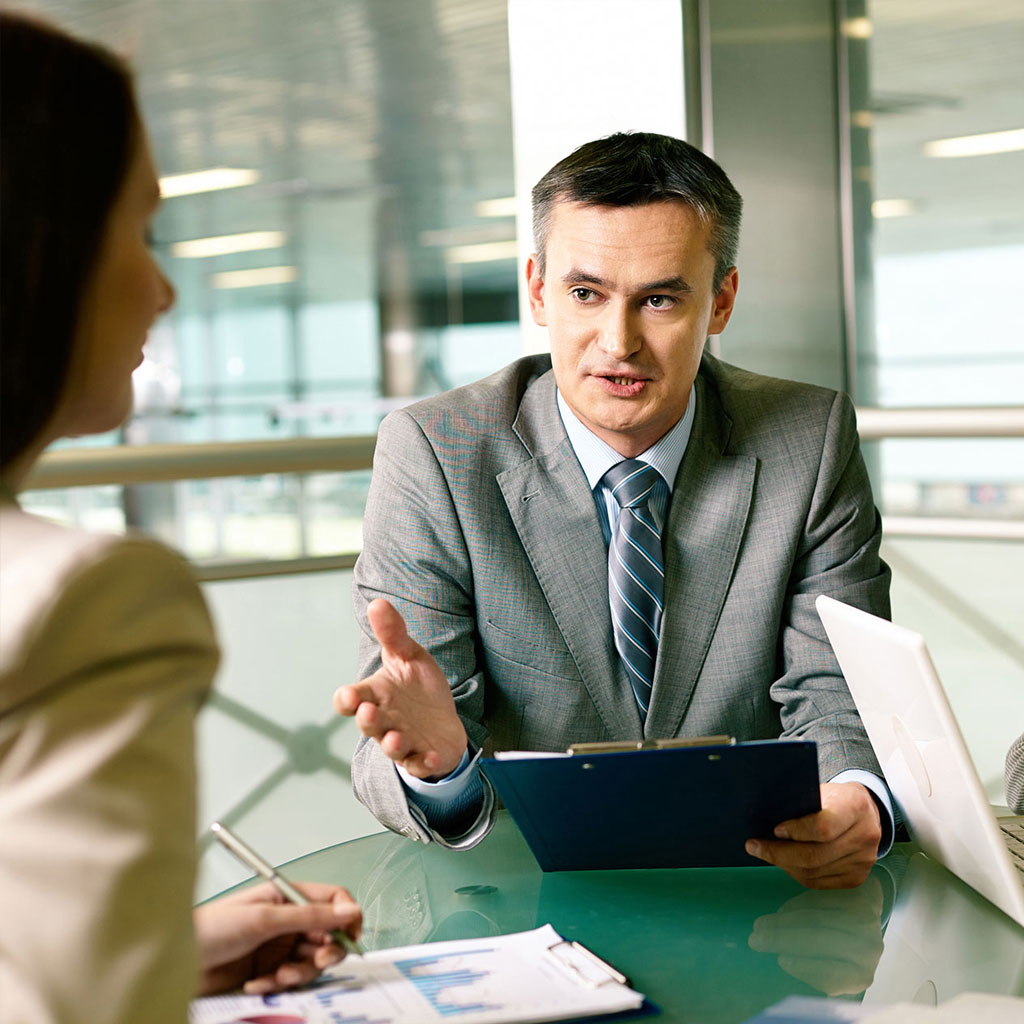 Finance professionals reviewing reports together